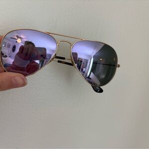 Rayban Aviators. Purple lens with gold frame.